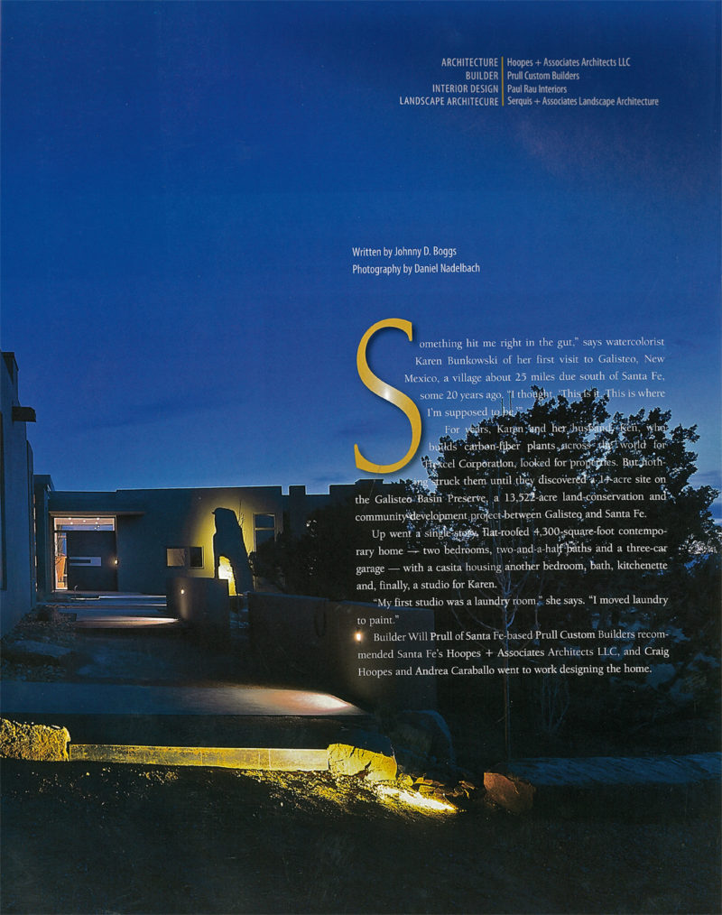 Magazine page featuring a modern Santa Fe home designed by Hoopes + Associates Architects with landscape architecture by Serquis + Associates, illuminated at night in the Galisteo Basin Preserve.